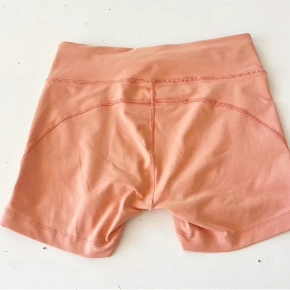 Outdoor Voices Tech Sweat Biker Shorts in Heathered Orange Peach - Picture 9 of 16